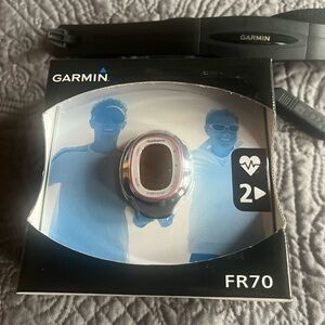 Garmin FR70 complete with heart monitor in box. In like new condition
